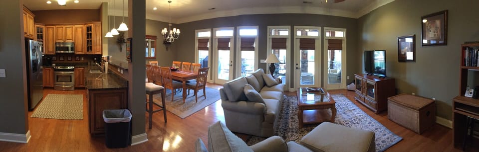 Panoramic of kitchen, dinning, and living room on Terrace level