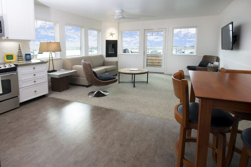 The spacious living room has a large flat-screen TV, fireplace and comfortable seating.