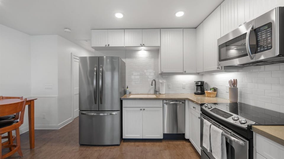 Fully stocked kitchen will high end appliances and everything you need to make a quick snack or full course meal