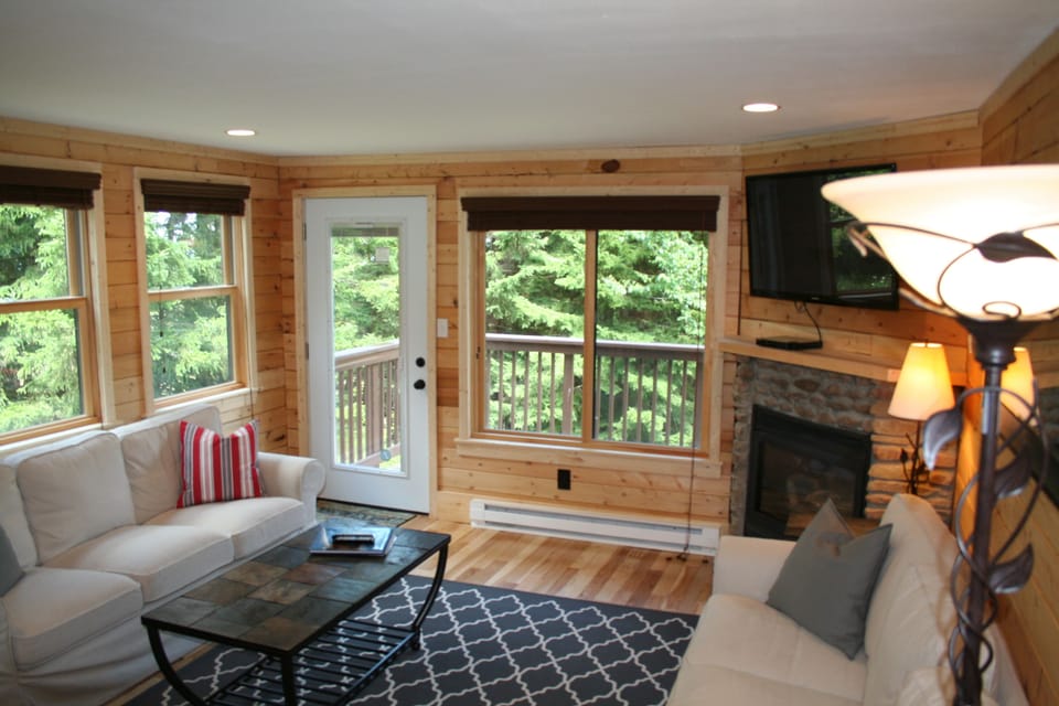 Great views from living room with 2 couches and easy chair