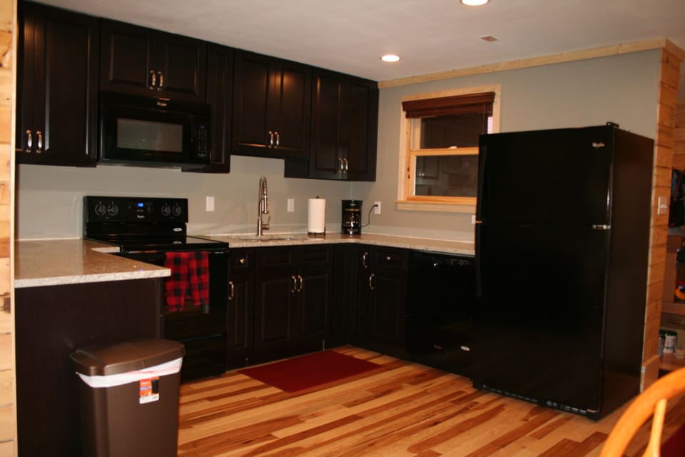 Beautiful well equipped kitchen with granite, stainless sink, and new appliances