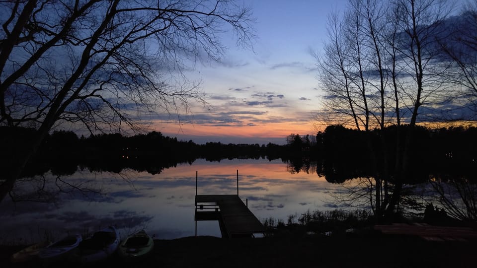 Calm waters just after an early spring sunset.

