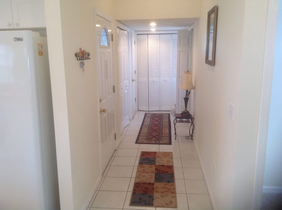 Front door,  utility corridor, washer/dryer, 1/2 bath , utility closet. 
