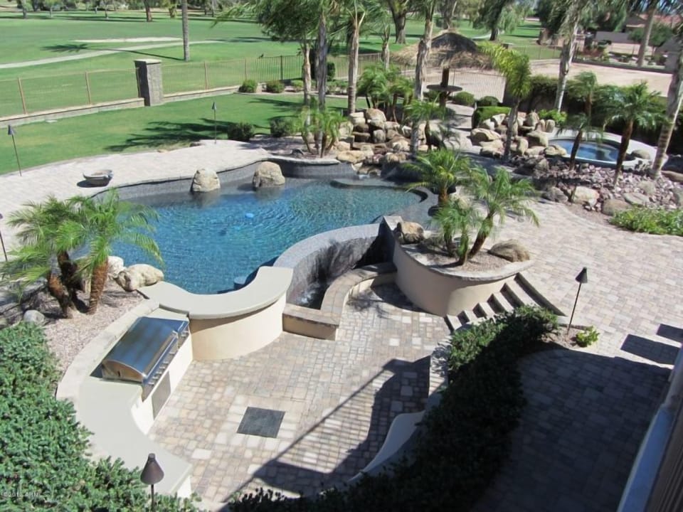 Your own heated pool, water features, heated spa and tiki bar on golf course.