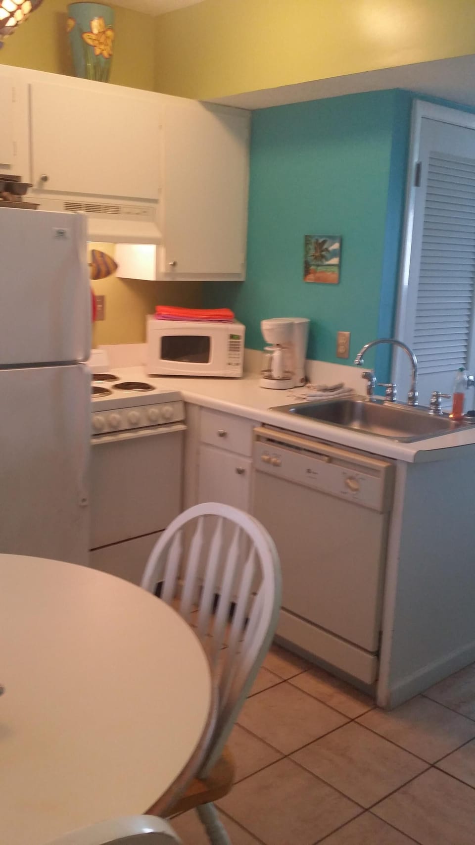 Full kitchen stocked with dishes and cookware