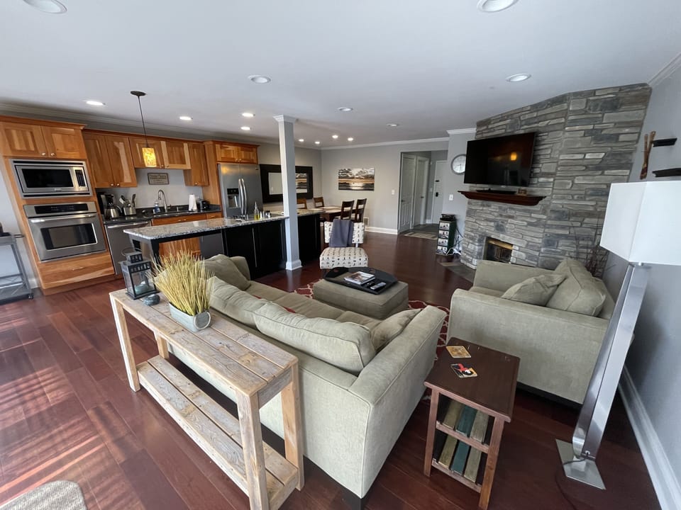 View of living/kitchen area. Entire condo painted in April ‘23