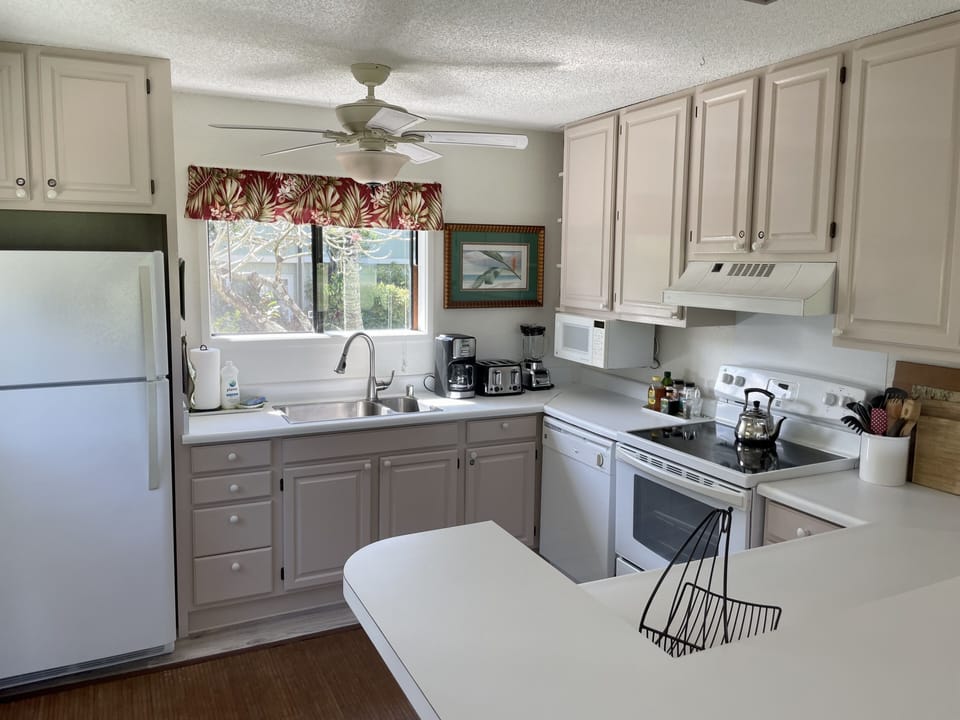 Cooking is easy in the well-equipped kitchen with newer appliances.