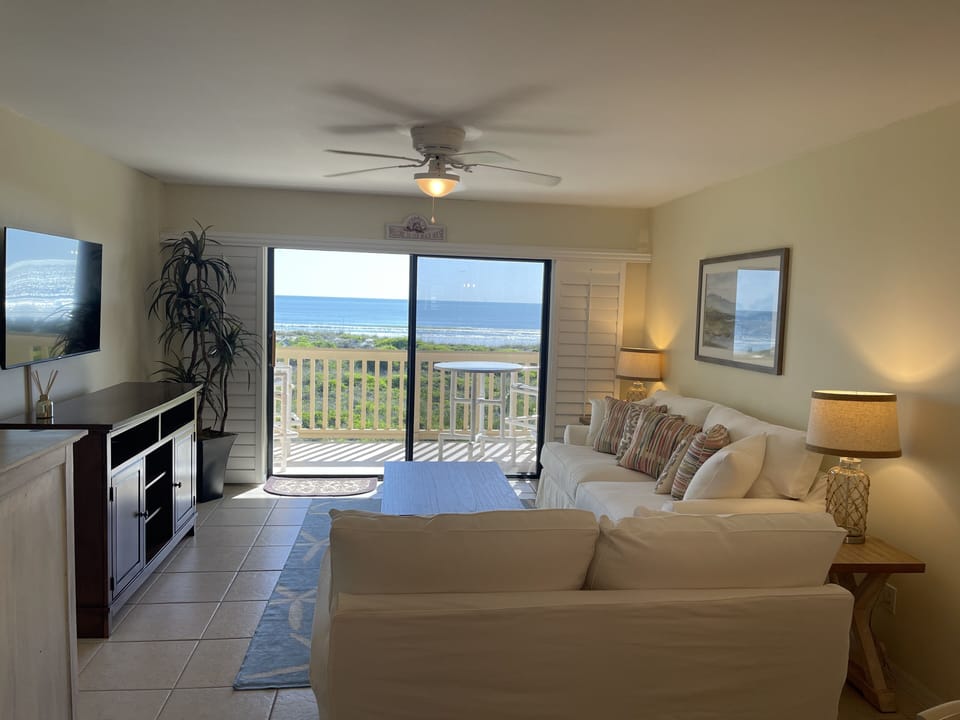 Living room overlooking the ocean…watch the dolphins 🐬 and the sunrise 🌅!