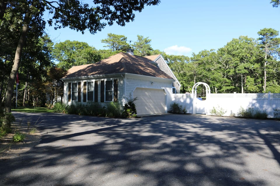 Garage, plentiful parking in loop driveway.