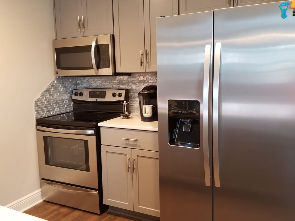 Electric Stove and Oven, Microwave, Coffee Maker, Frig With Ice Maker