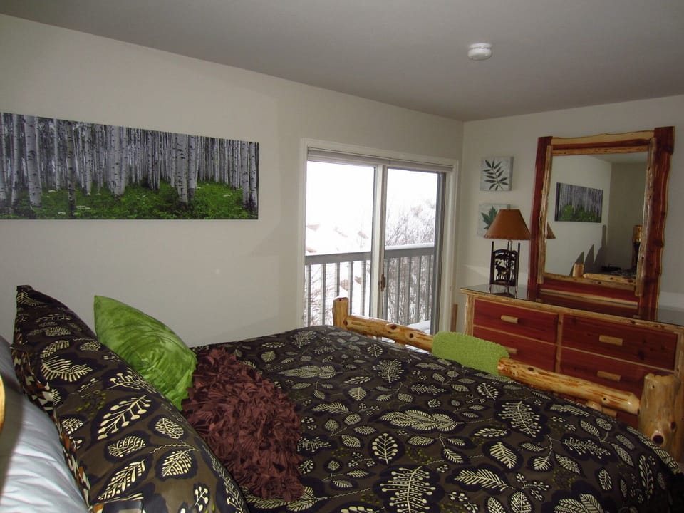 Master bedroom, king-sized bed, deck