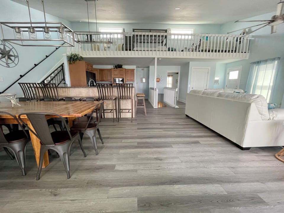 Upstairs loft area with separate queen bed and twin over full over twin trundle.