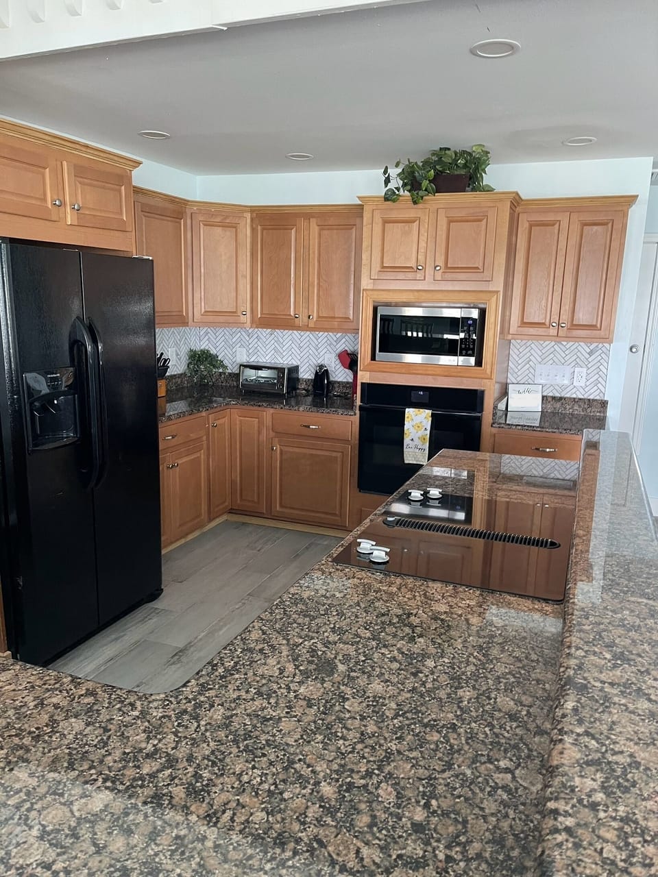 Spacious open kitchen with JennAir stove, bluetooth oven, granite counter tops.