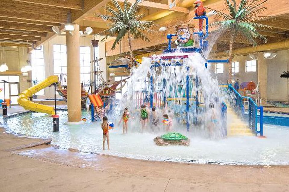 6 free daily passes to indoor/outdoor water park with lazy river and swim up bar