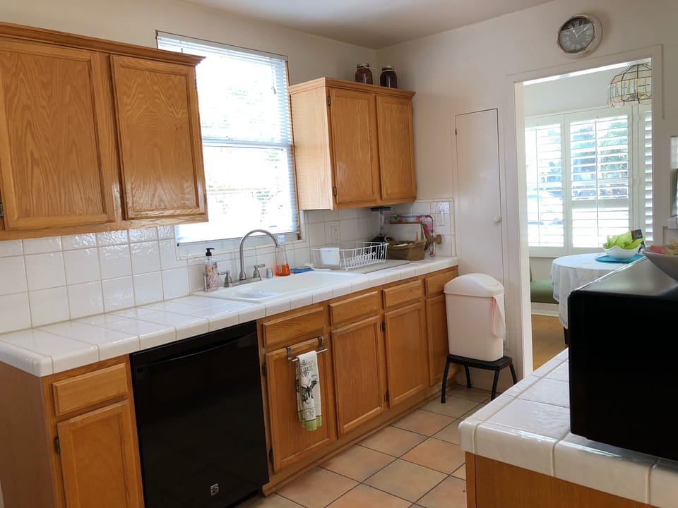 Fully stocked kitchen with most cooking necessities 