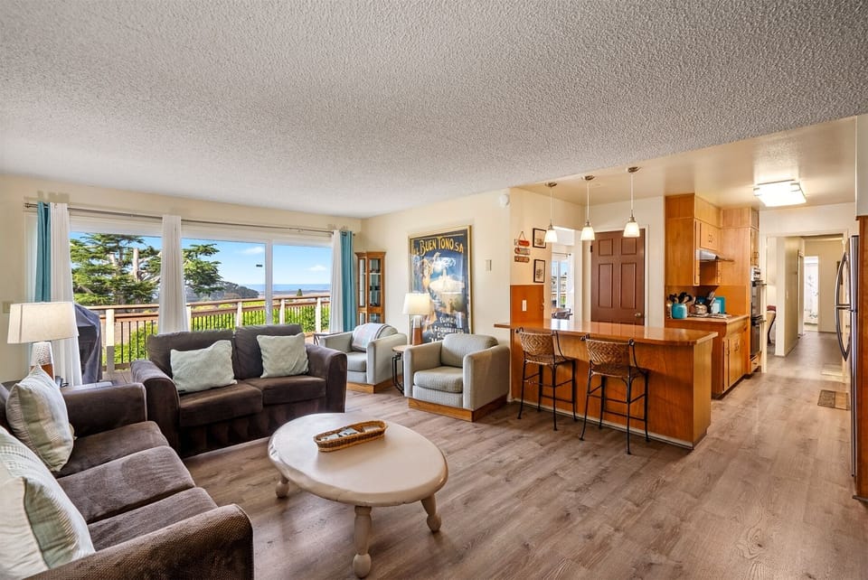 The large den is open to the kitchen and perfect for friends and family