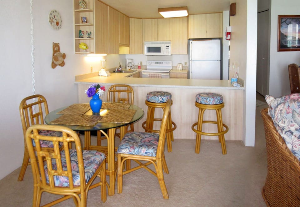 Dining table and view of kitchen