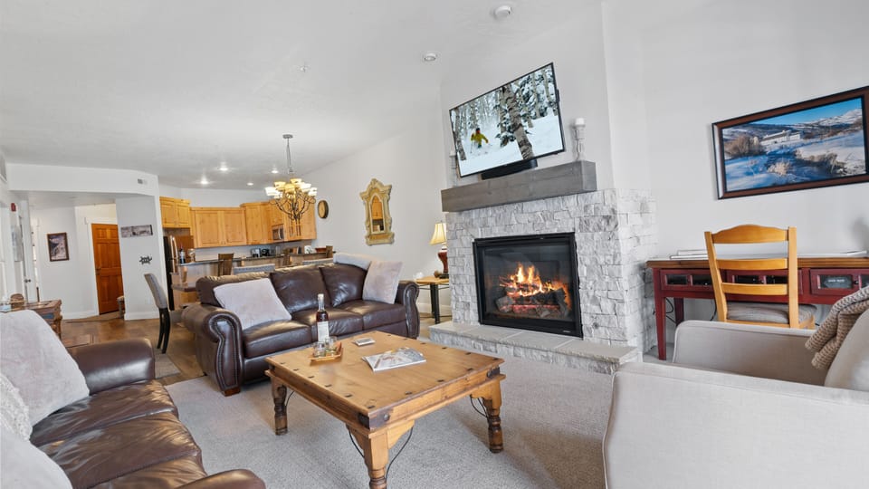 Cozy up by the fireplace and TV after a day on the slopes. 
