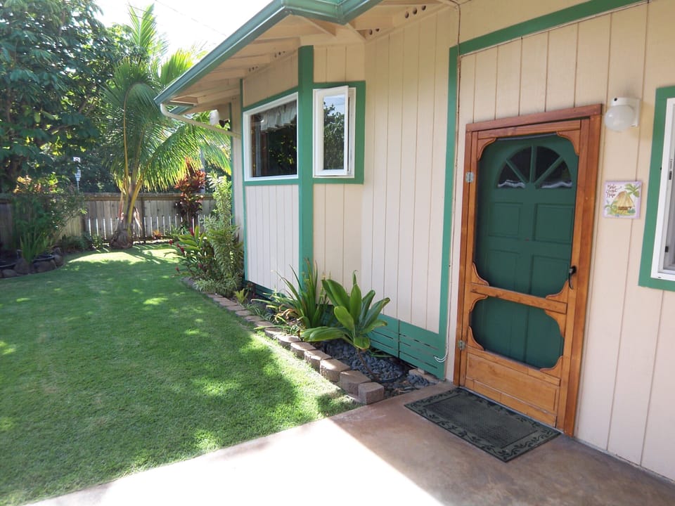 One of two entry doors with the kitchen bay window overlooking the front yard. 