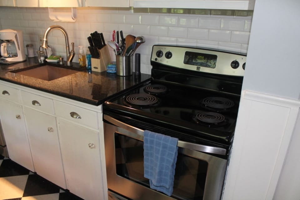 Downstairs Kitchen with New Appliances (Oven and Dishwasher) and Granite