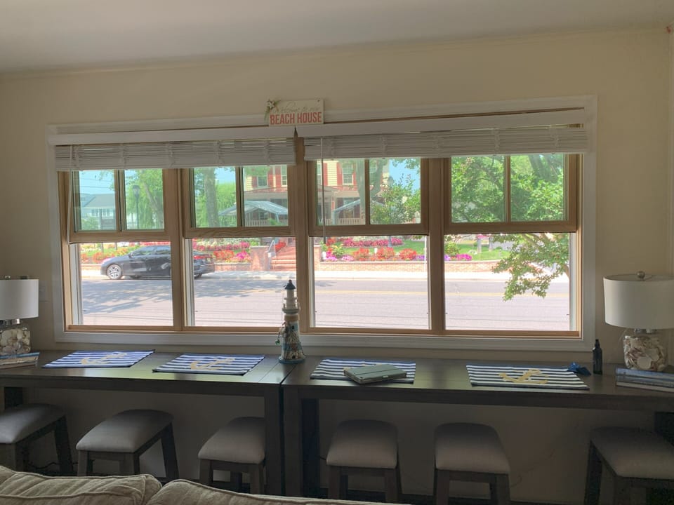 Front windows to watch the carriages go by and people watching.
