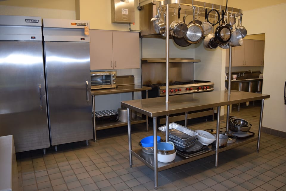 Updated commercial kitchen w/ dishwasher & all you need to prepare/serve meals.