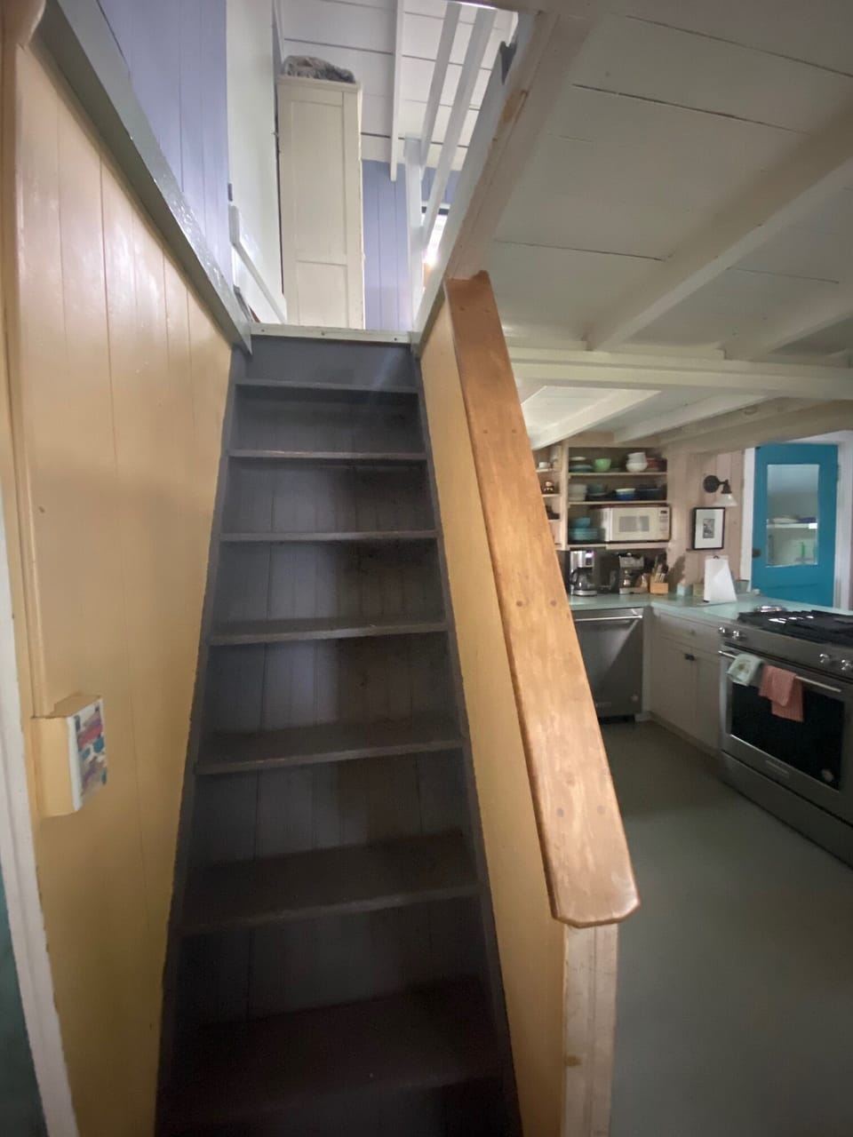 Back staircase from kitchen to back queen bedroom