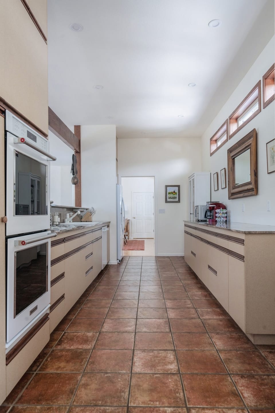 kitchen with newer double oven, fridge & dishwasher