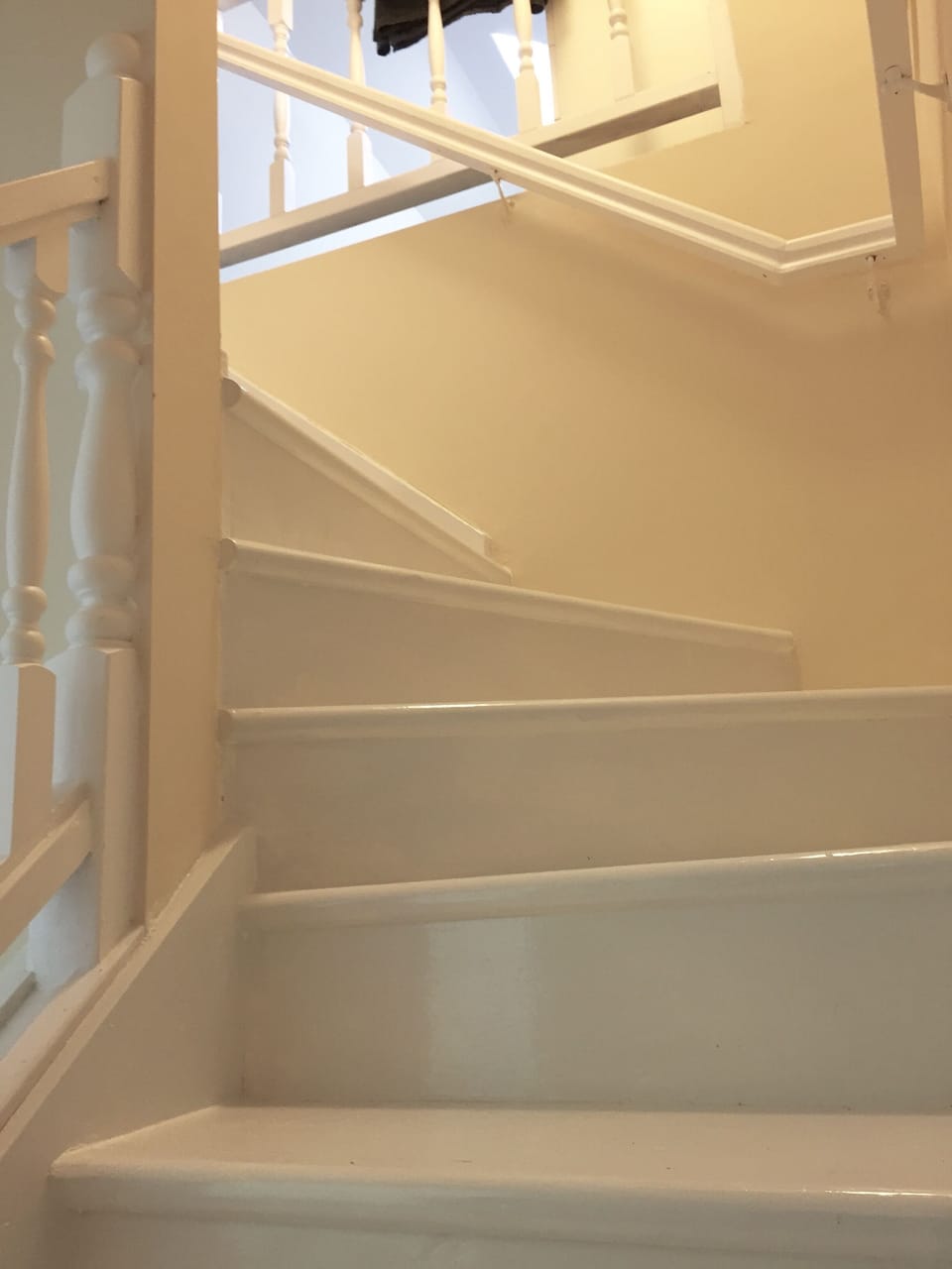Spiral staircase leading to attic bedrooms