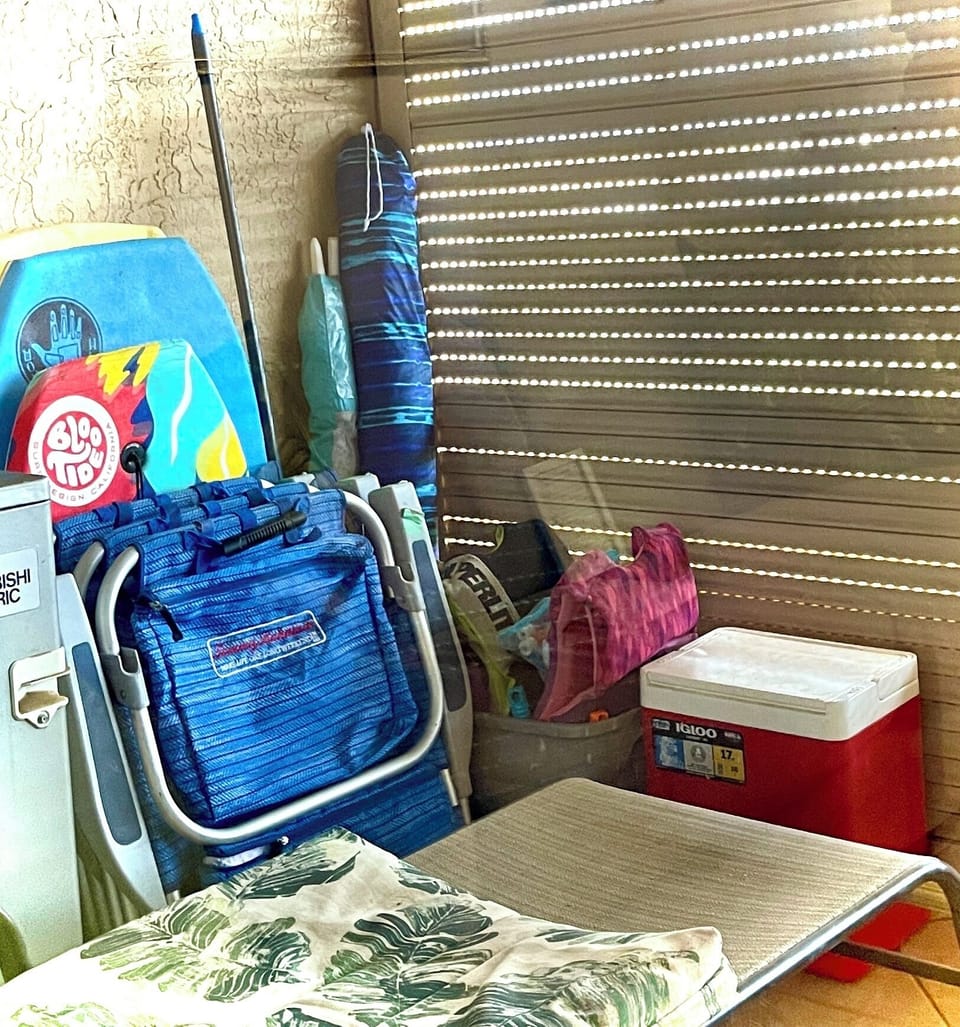 We have beach chairs, umbrellas, a cooler, body boards & fins, & other toys.