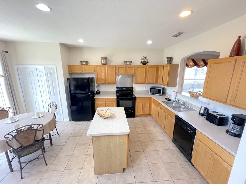 Large open kitchen with view of the private pool