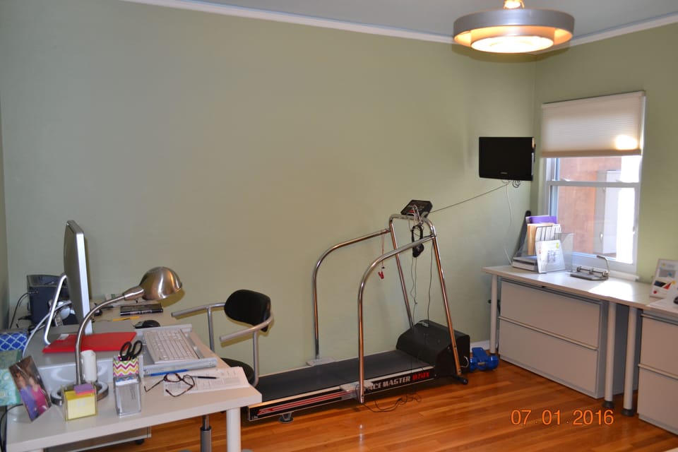 Office with tread mill and TV. Can be used as a sleeping room.