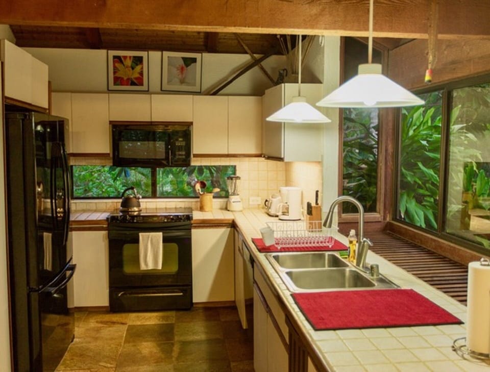 Kitchen and bay window looking over grounds & mountains