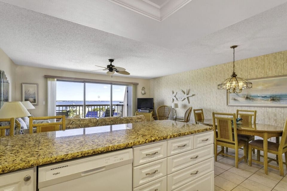 View from the Kitchen. You can see Boca Ciega Bay out the patio doors. Stay4 wks