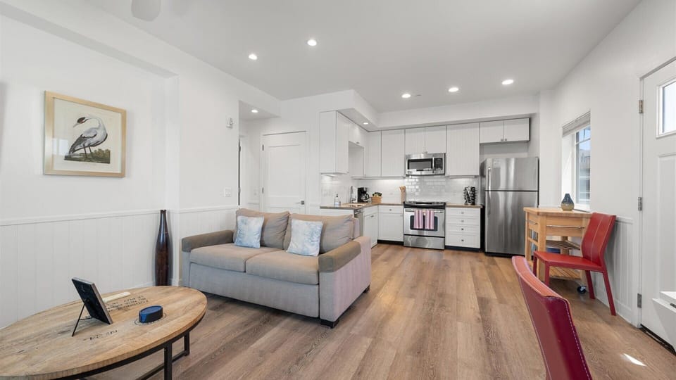 The living room features a queen sized sleeper sofa for additional sleeping space