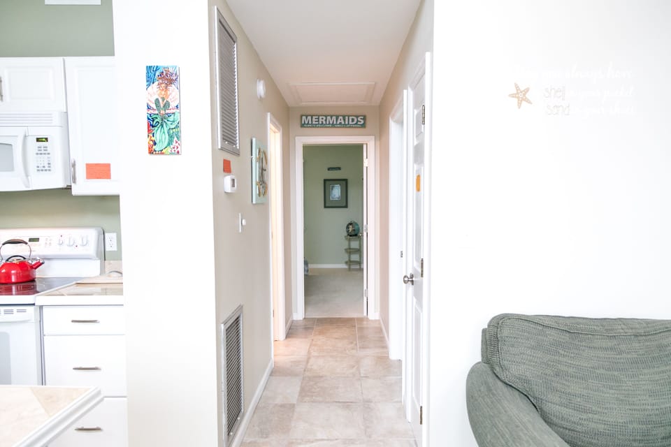 Kitchen on the left, living room on the right. Straight ahead is the mermaid 