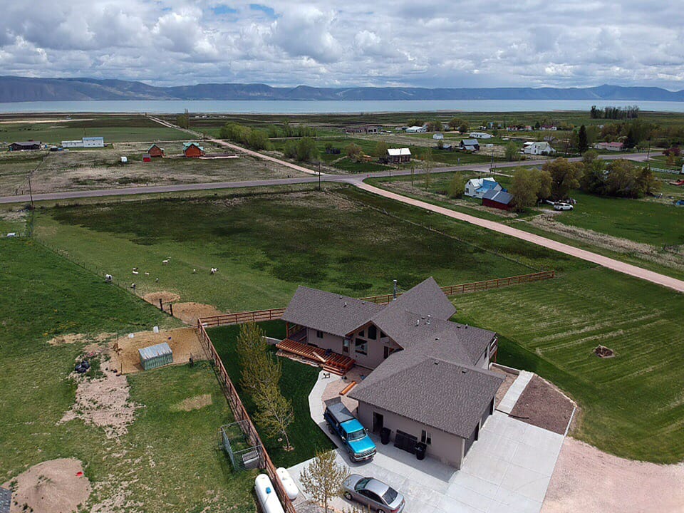 Aerial view showing house and Bear Lake