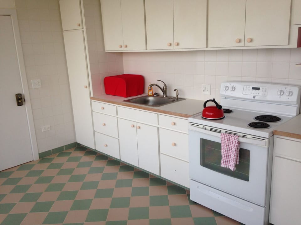 Upper level kitchen of in the guest house.