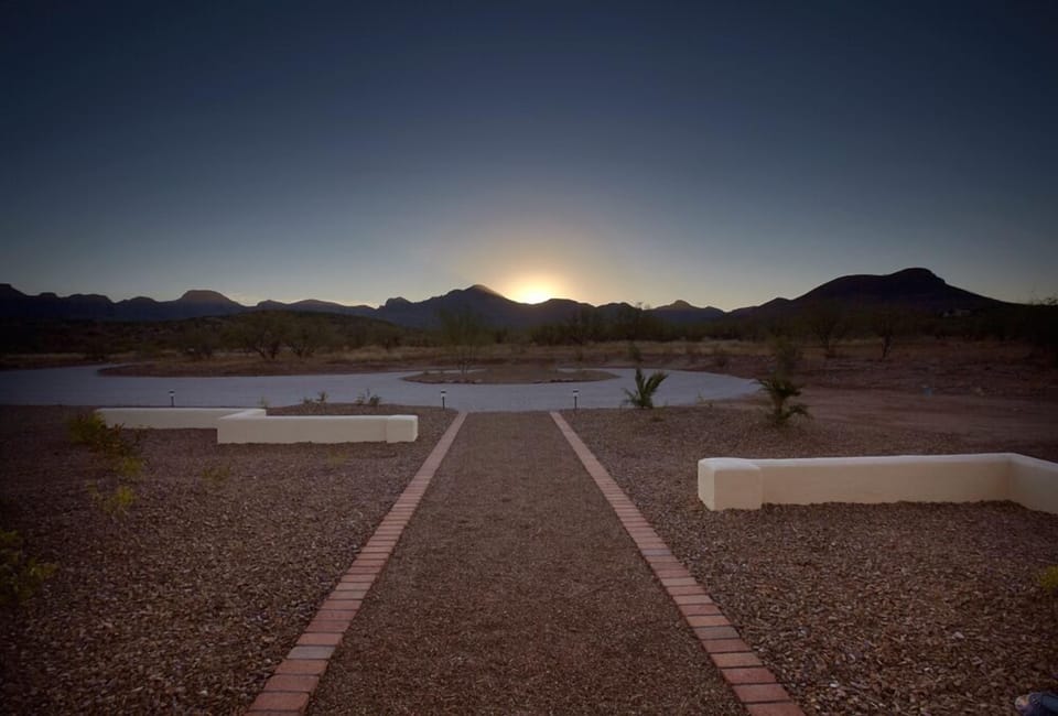 Sunset behind circular drive.