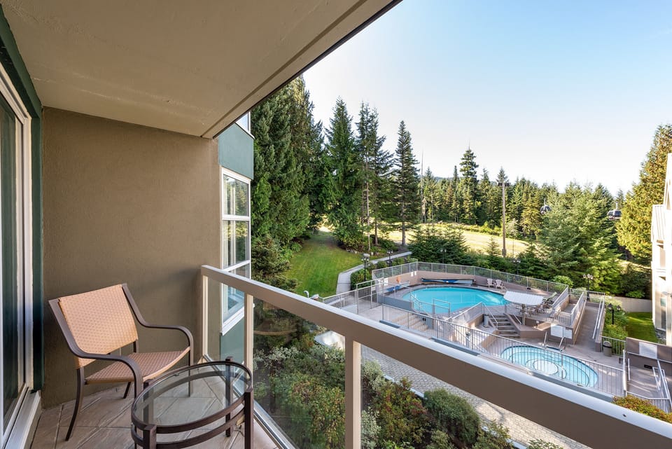 Master balcony - see the pool, hot tub & ski slope from our LR, DR, & Master BR