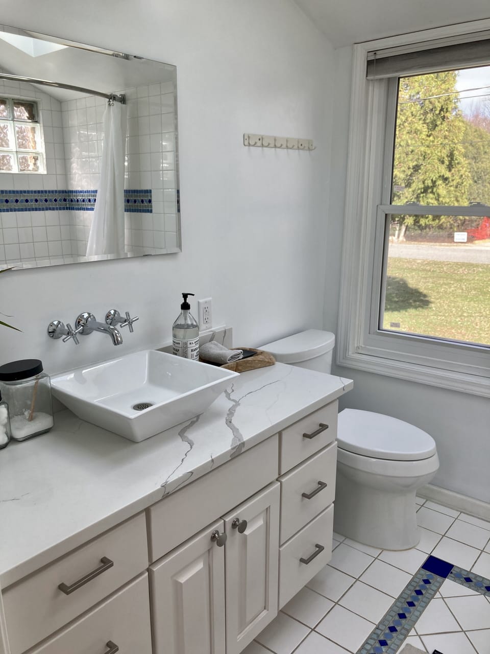 Full bath off living room w jacuzzi tub, shower, skylights