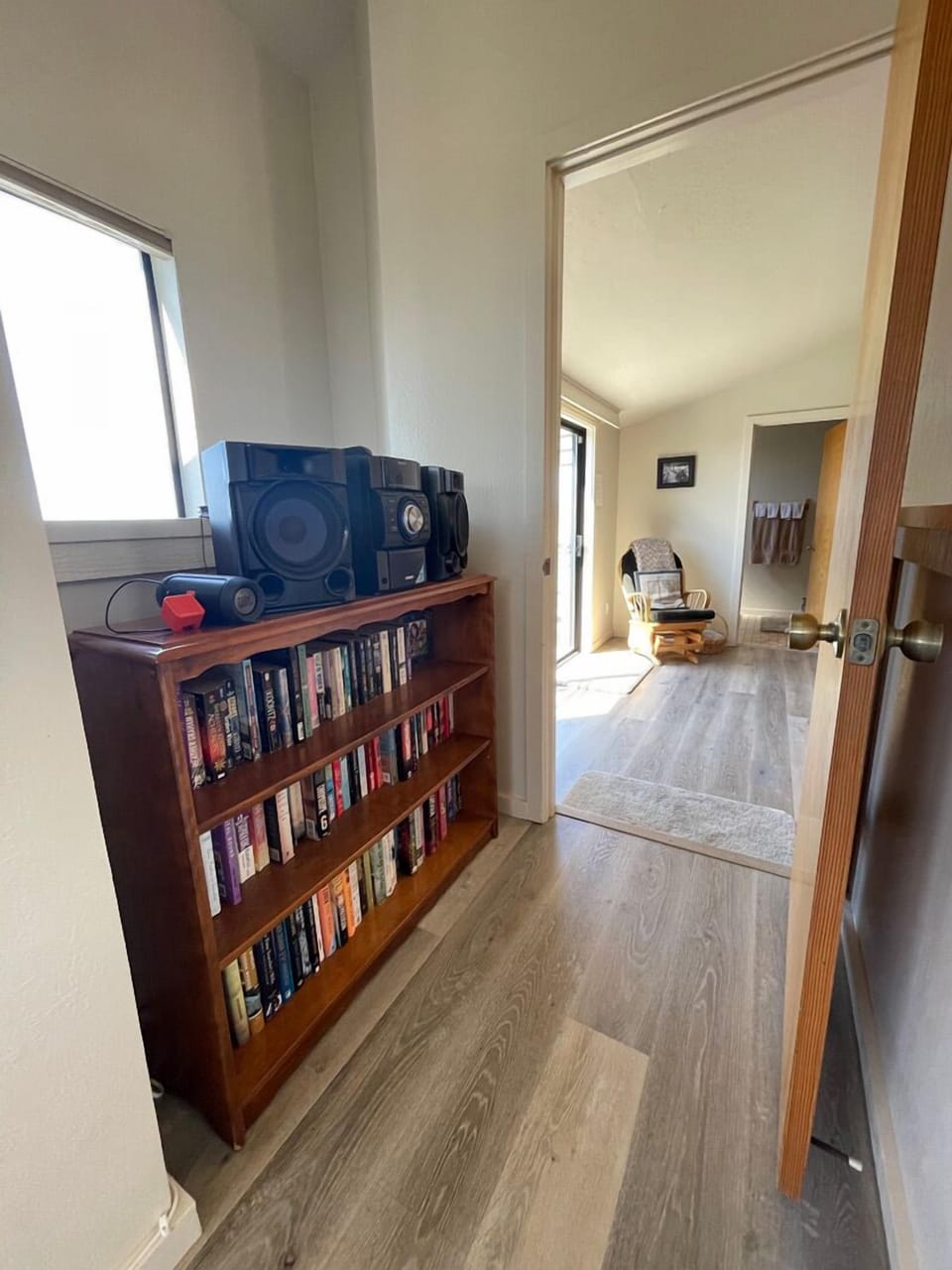 Bookcase; door entering Mstr Bdrm 2 from living room.