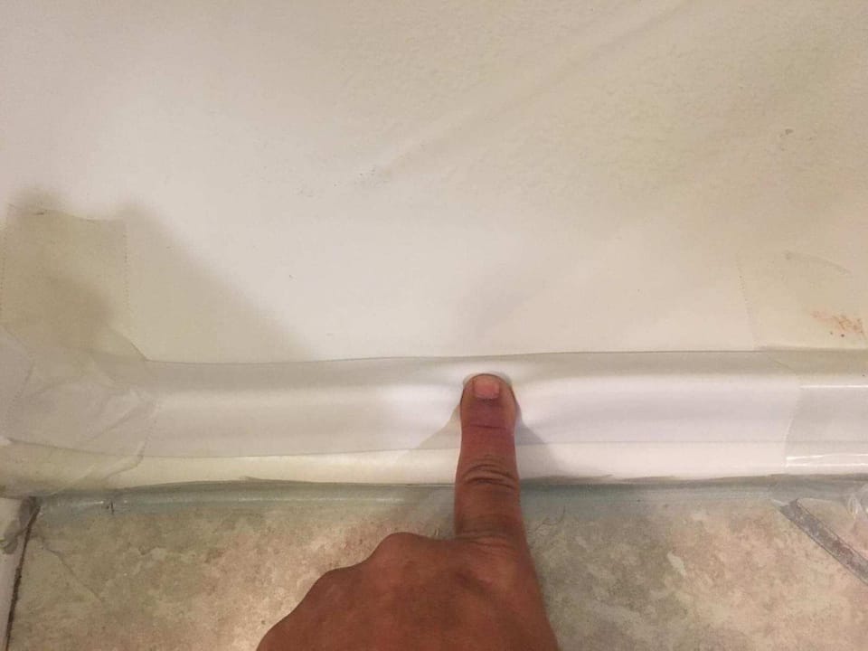 collapsible shower step for easy entry to shower in accessible bathroom