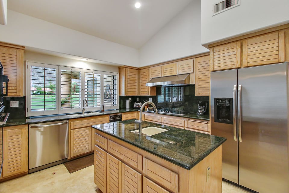 Fully equipped gourmet kitchen with stainless steel appliances
