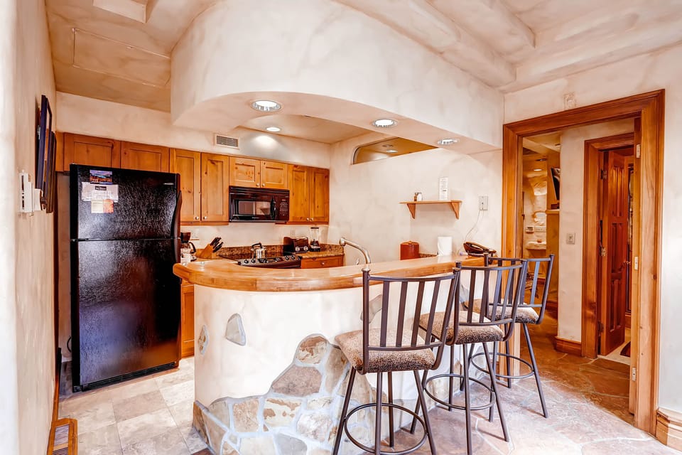Kitchen with breakfast bar looking to Master
