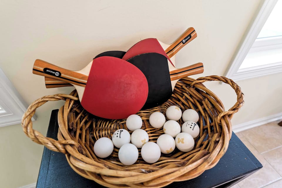 Ping pong balls and paddles ready to be played
