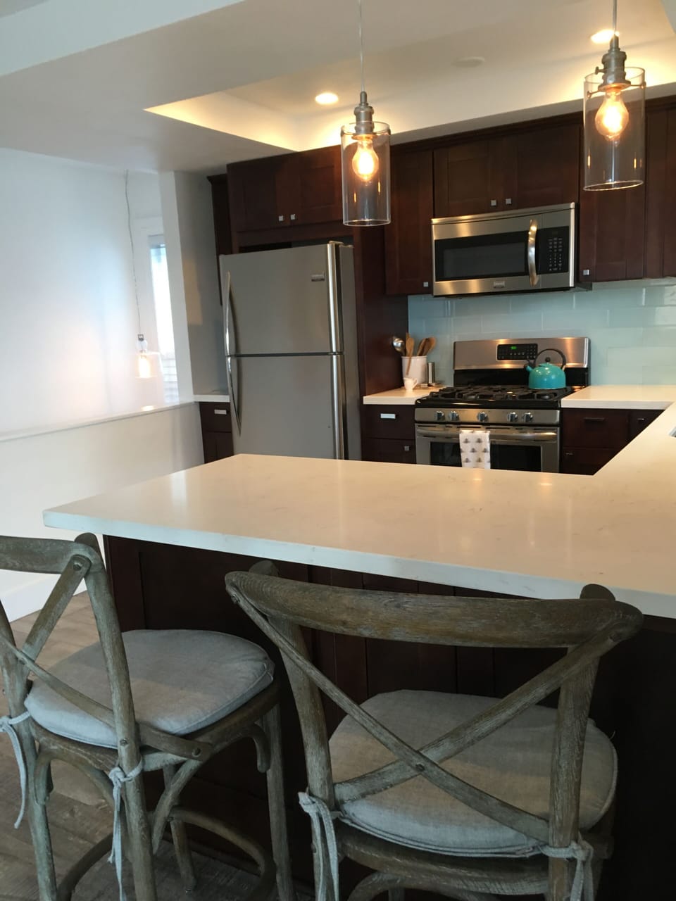 under cabinet lighting, new windows, blinds and curtains, light and bright