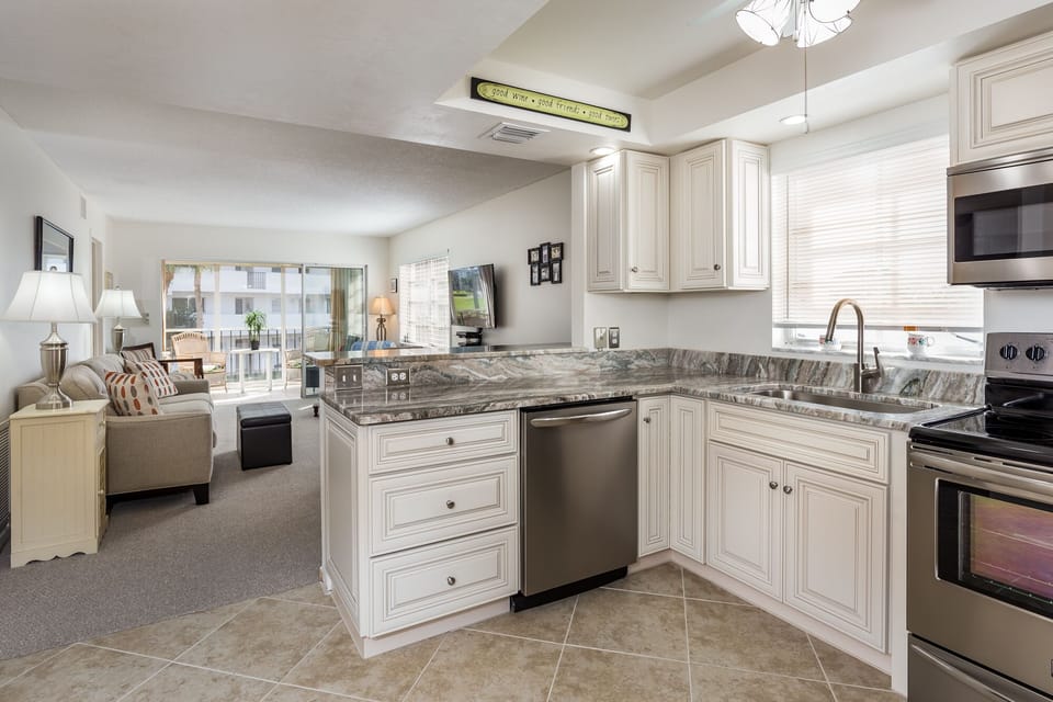 Kitchen with Granite Countertops, Brand New Appliances and Cabinets. 