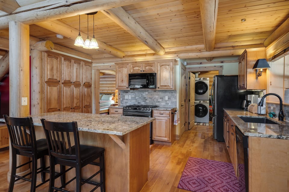 The refrigerator is now recessed into the wall and does not extend into doorway.