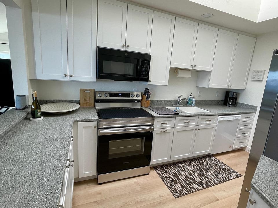 Fully equipped kitchen with modern appliances.